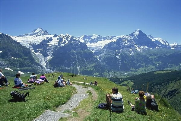 Walkers resting at First and looking to Schreckhorn