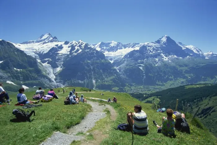 Framed Print : Walkers resting at First and looking to Schreckhorn Framed Print : Walkers resting at First and looking to Schreckhorn