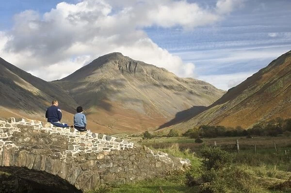 Two walkers resting, looking to Great Gable 2949ft, Wasdale Valley, Lake District National Park