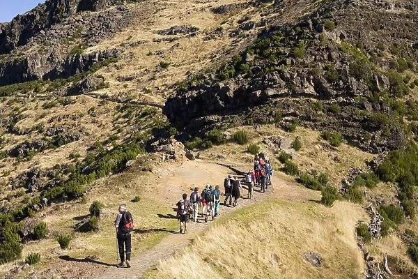 Walkers stride out on a marked footpath on the Pico Ruivo on the island of Madeira