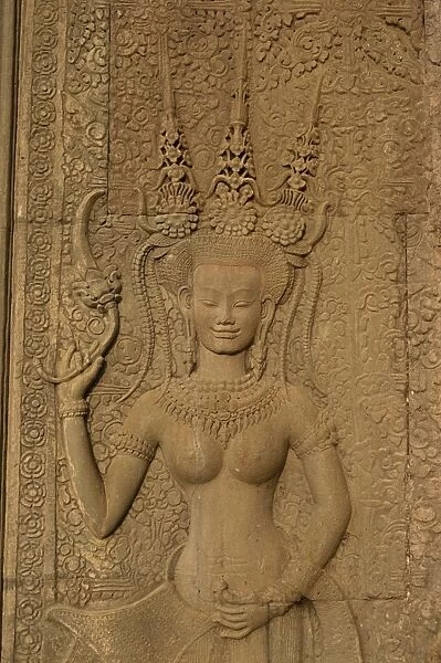 Detail of wall carving depicting an apsara at Angkor Wat, UNESCO World Heritage Site