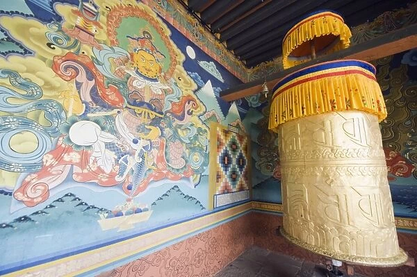 Wall painting and prayer wheel, Punakha Dzong dating from 1637, Punakha, Bhutan, Asia
