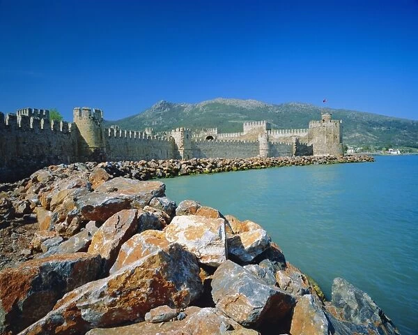 Walls and towers of Mamure Kalesi touching the Meditteranean Sea