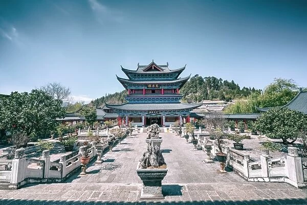 Wanjuan Pavilion, one of the main buildings at Mufu Wood Mansion with potted bonsai and rocks, Lijiang, Yunnan, China, Asia