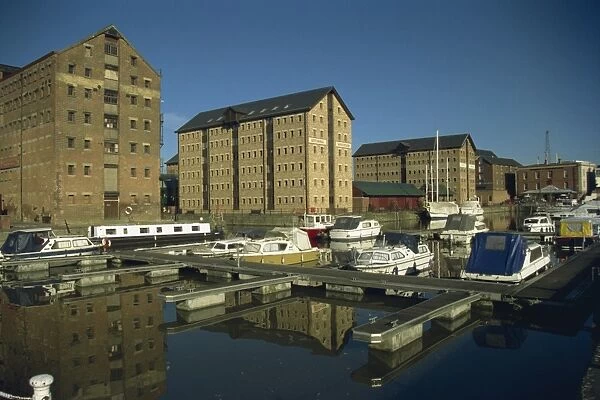 Warehouses and boats in marina at docks, Gloucester, Gloucestershire, England