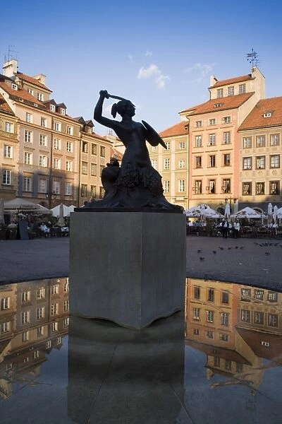 Warsaw Mermaid Fountain and reflections of the Old Town houses