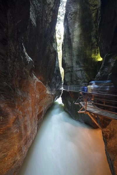 Water of creek flows in the narrow limestone gorge carved by river, Aare Gorge, Bernese Oberland