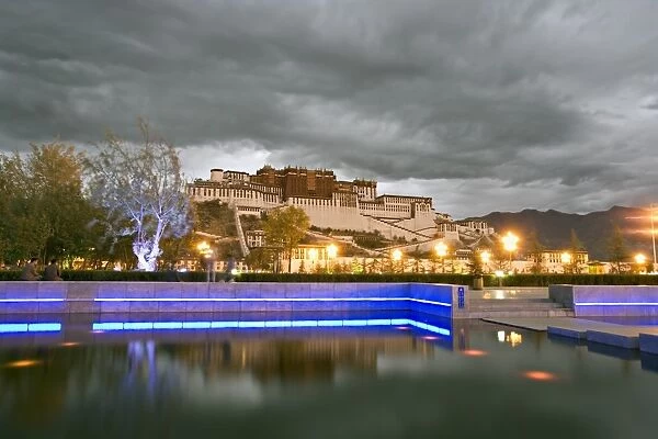 Water feature in front of the Potala Square lit up with neon blue lights in early evening