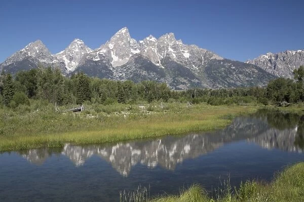 Water reflections of the Teton Range, taken from the end of Schwabacker Road, Grand Teton National Park, Wyoming, United States of America, North America