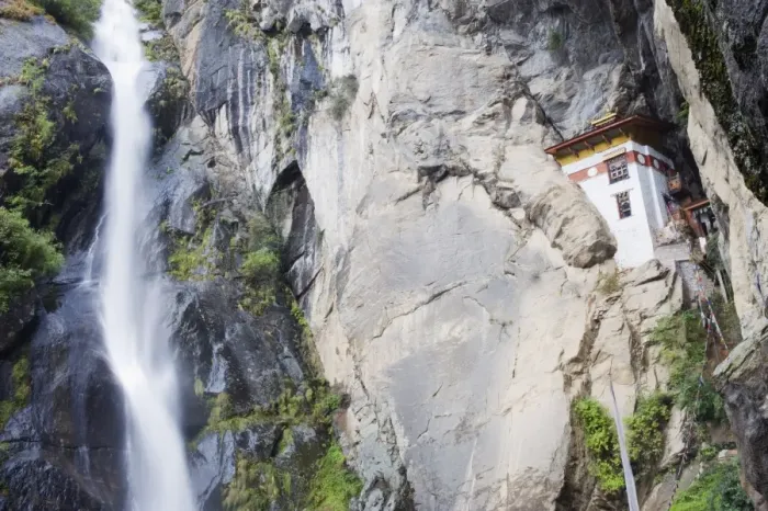 Framed Print : A waterfall flowing past a temple built into the side of a cliff, Tigers Nest Framed Print : A waterfall flowing past a temple built into the side of a cliff, Tigers Nest