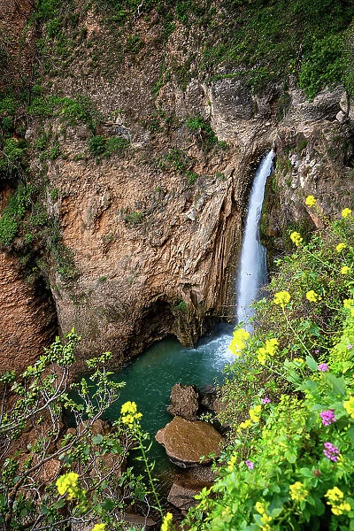 Waterfall near historic bridge of Ronda in Pueblos Blancos region, Andalusia, Spain, Europe