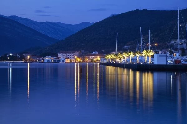 Waterfront at dusk at the newly developed Marina in Porto Montenegro with mountains behind