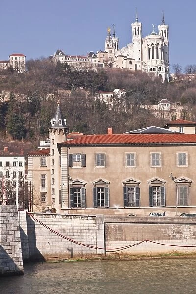 The waterfront in Old Lyon with the Basilica Notre Dame de Fourviere on the hill, Lyon, Rhone-Alpes, France, Europe