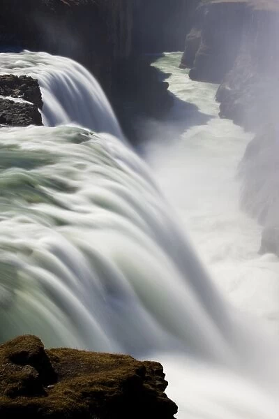 Waters of Gullfoss, Europes biggest waterfall, thundering into a deep ravine