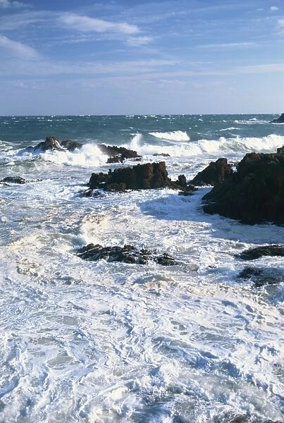 Waves breaking on the rocks along the Corniche D Esterel on the Cote d Azur