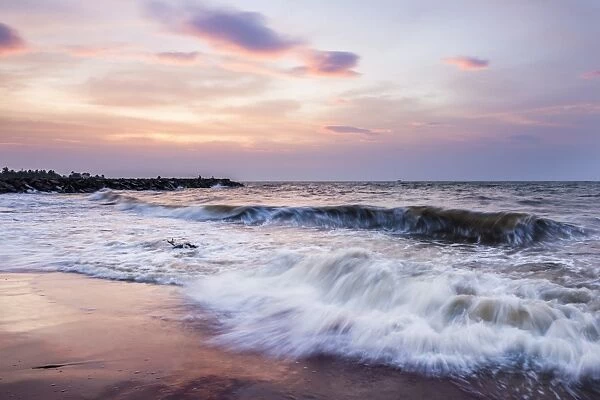 Waves crashing on Negombo Beach at sunset, West Coast of Sri Lanka, Asia