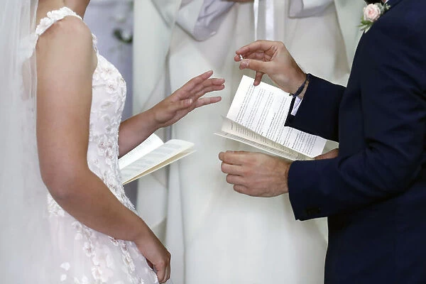 Wedding ceremony in a Catholic church, wedding rings being exchanged, France, Europe
