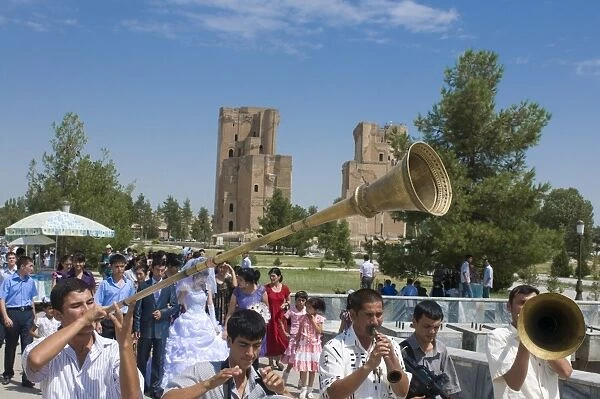 Wedding ceremony in Shakrisabz in the background the Ak Saray Palace, Uzbekistan