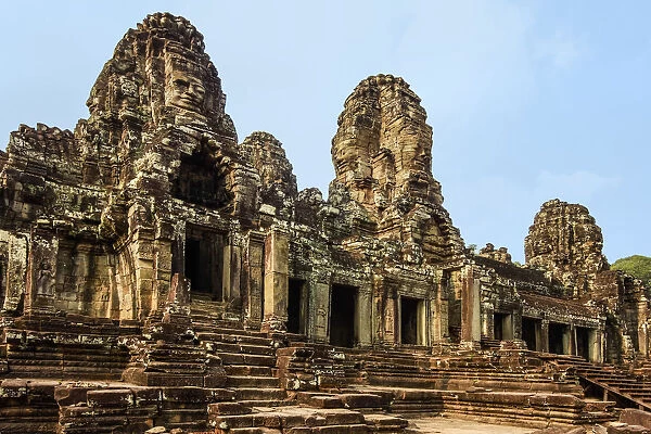 West inner gallery towers and seven of the 216 carved faces at Bayon temple in Angkor