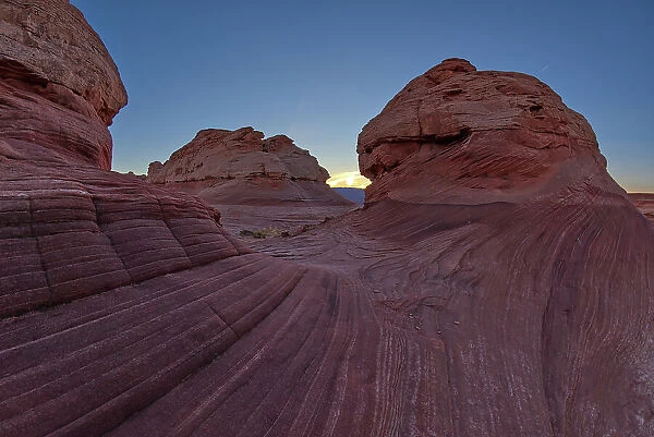 The west rock ridge of the New Wave along the Beehive Trail at sundown, Glen Canyon Recreation Area, near Page, Arizona, United States of America, North America