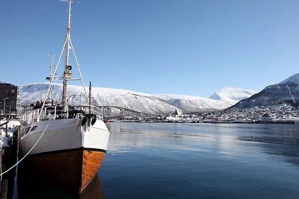 Whaler in Tromso harbour with the Bridge and Cathedral in background, Tromso, Troms, Norway, Scandinavia, Europe