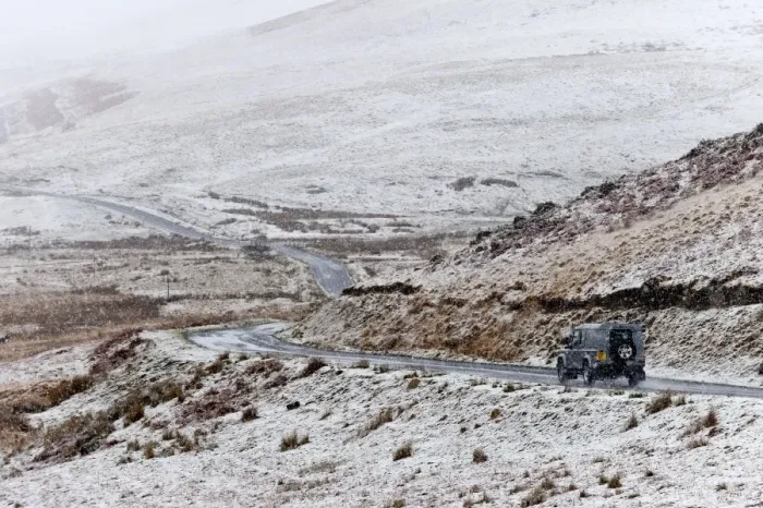 Framed Print : A four wheel drive vehicle negotiates a road through a wintry landscape in the Elan Framed Print : A four wheel drive vehicle negotiates a road through a wintry landscape in the Elan
