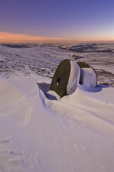 Wheelstones in the snow at sunset on Stanage Edge, Peak District National Park