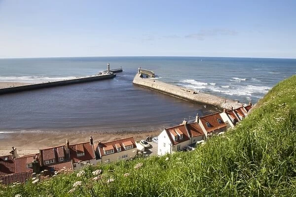 Whitby harbour walls and lighthouses from the clifftop, Whitby, North Yorkshire, Yorkshire, England, United Kingdom, Europe