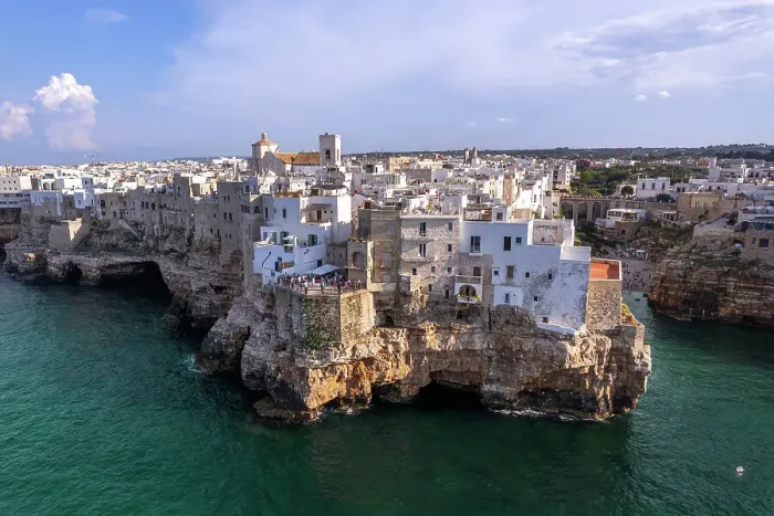 Framed Print : The white buildings on top of the cliff of the fishing village of Polignano a Mare, Bari province, Apulia, Italy, Europe