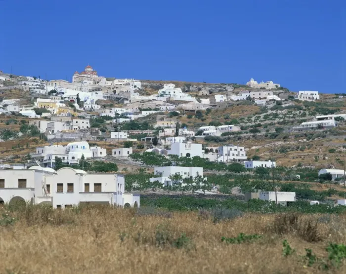 Framed Print : White buildings in village on a hillside with church on skyline Framed Print : White buildings in village on a hillside with church on skyline