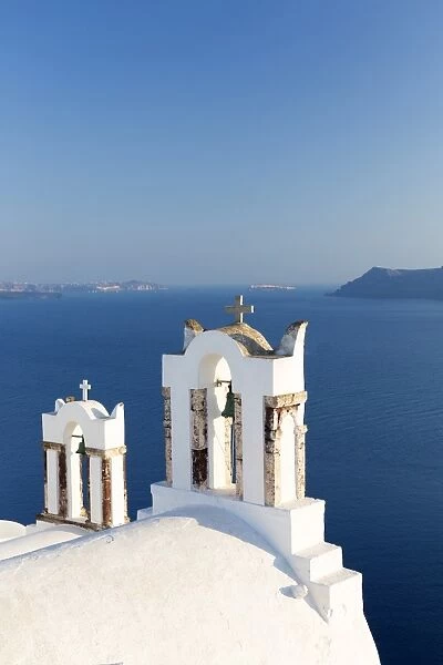 White church belltowers overlooking the Caldera, Oia, Santorini, Cyclades, Greek Islands