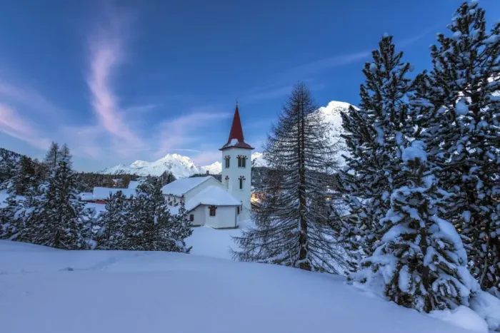 Framed Print : The white church of Maloja Pass in the winter fairy-tale landscape of the Engadine Valley at the blue hour, Graubunden, Switzerland, Europe Framed Print : The white church of Maloja Pass in the winter fairy-tale landscape of the Engadine Valley at the blue hour, Graubunden, Switzerland, Europe