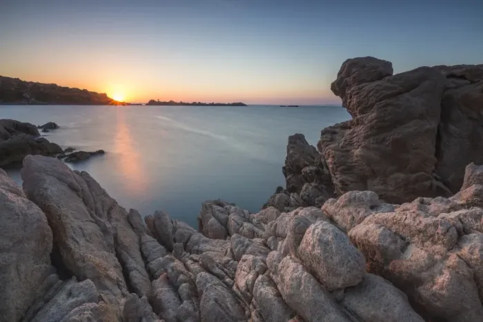 Framed Print : White cliffs and blue sea framed by the lights of sunset Santa Teresa di Gallura Framed Print : White cliffs and blue sea framed by the lights of sunset Santa Teresa di Gallura