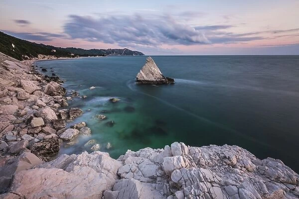 White cliffs frame the turquoise sea at sunrise, La Vela Beach, Portonovo, province of Ancona