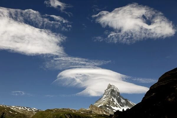 White clouds and the Matterhorn, Zermatt, Valais, Swiss Alps, Switzerland, Europe