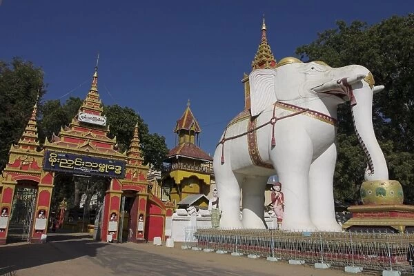 White elephant guards entrance to Thanboddhay Paya built in the 20th century by Moehnyin Sayadaw