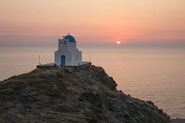 White Greek Orthodox chapel of Eftamartyres on headland at sunrise, Kastro, Sifnos