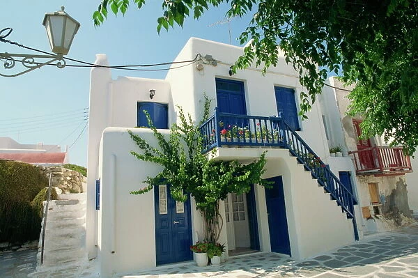 White house with blue doors and shutters on Mykonos