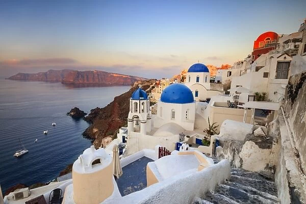 White houses and blue domes of the churches dominate the Aegean Sea, Oia, Santorini