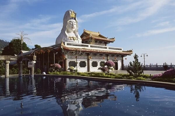 White Kuan Yim statue shrine and pond
