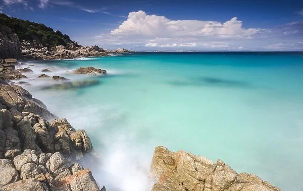 White rocks and cliffs frame the waves of turquoise sea, Santa Teresa di Gallura