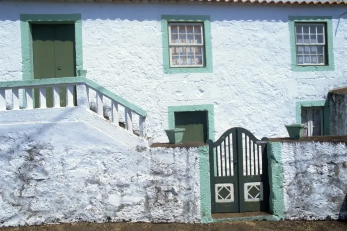 Framed Print : Whitewashed house with wall and gate at Terras on Framed Print : Whitewashed house with wall and gate at Terras on