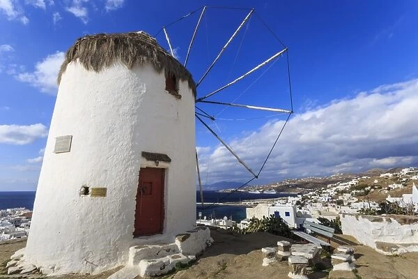 Whitewashed windmill, view of Mykonos Town (Chora) and cruise ships in distance, Mykonos