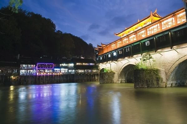 Wind and rain bridge illuminated at night, Fenghuang, Hunan Province, China, Asia