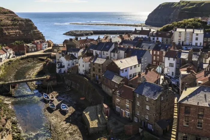 Framed Print : Winding alleys, fishing boats and sea, elevated view of village in summer, Staithes Framed Print : Winding alleys, fishing boats and sea, elevated view of village in summer, Staithes