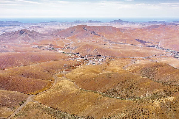 Winding road in the desert landscape from Mirador del Risco de las Penas viewpoint