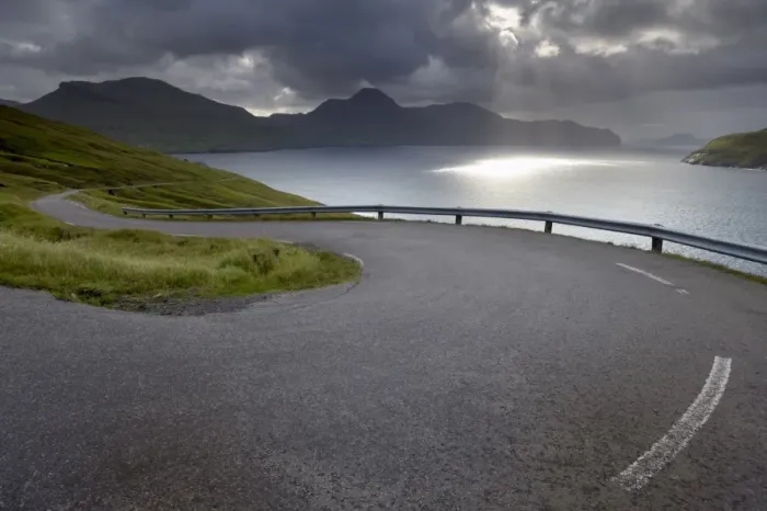 Framed Print : Winding road near Kvivik, and Vestmannasund between Vagar on the right