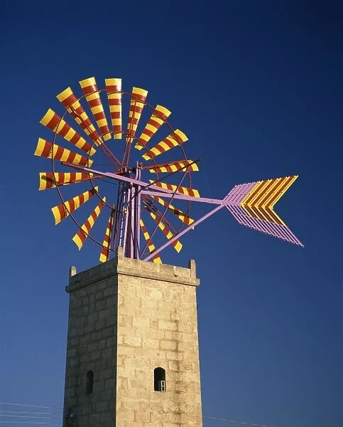 Windmill with sails in the colours of the Mallorcan flag