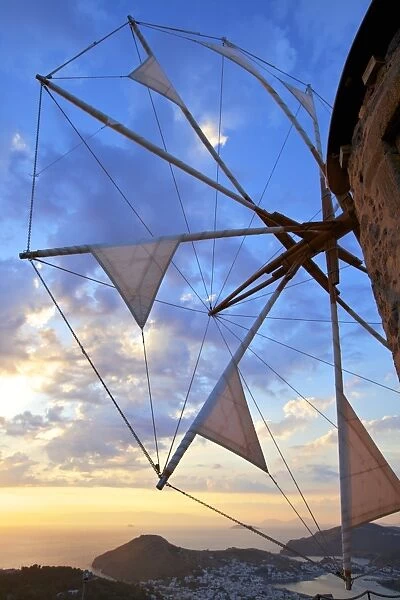 Windmills of Chora overlooking Skala at sunset, Patmos, Dodecanese, Greek Islands