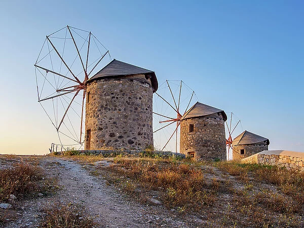 Windmills of Patmos Chora at sunset, Patmos Island, Dodecanese, Greek Islands, Greece, Europe